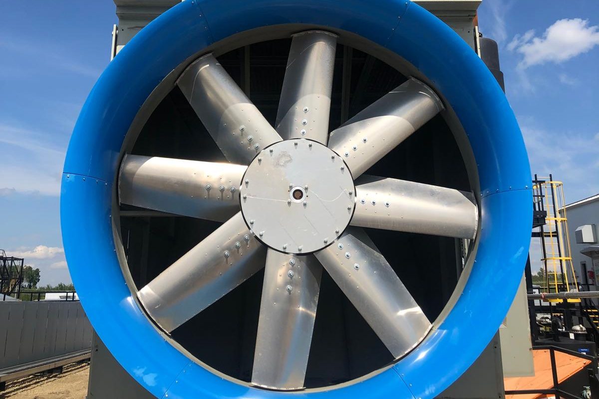 An E-Bell™ inlet bell, painted blue, on an eight blade axial fan, seen head on