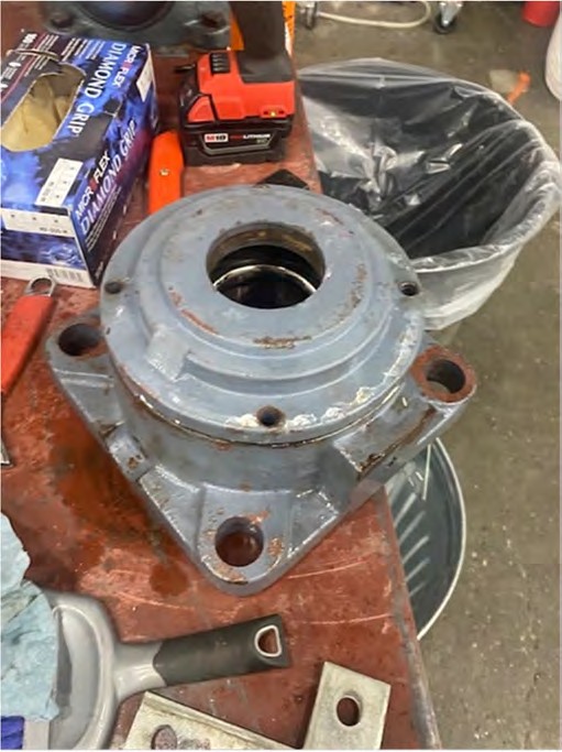 Failed SCF316 spherical roller bottom bearing from a Korean built air cooler, removed and on a bench